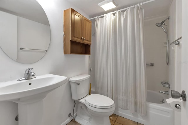 full bathroom with sink, toilet, shower / tub combo with curtain, and tile patterned floors