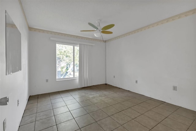 spare room featuring ceiling fan and light tile patterned floors