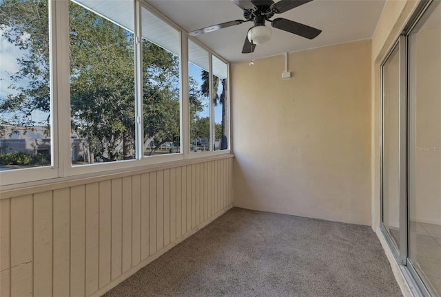 unfurnished sunroom with ceiling fan and a wealth of natural light