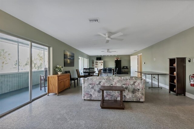 21280 Brinson Ave Unit 214, Port Charlotte, FL 33952 - living area with baseboards, ceiling fan, and visible vents