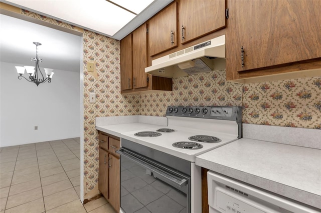 21280 Brinson Ave Unit 214, Port Charlotte, FL 33952 - kitchen with light countertops, white dishwasher, under cabinet range hood, and electric range