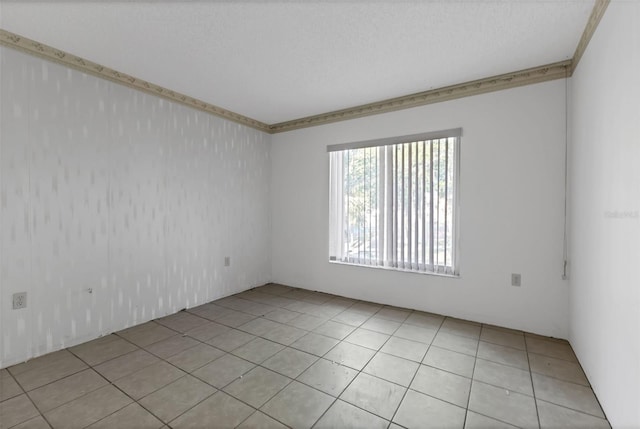 21280 Brinson Ave Unit 214, Port Charlotte, FL 33952 - spare room featuring light tile patterned floors and crown molding