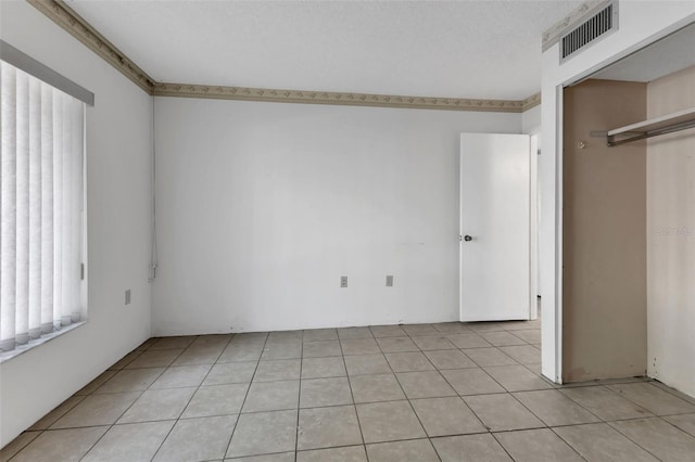 21280 Brinson Ave Unit 214, Port Charlotte, FL 33952 - unfurnished bedroom with light tile patterned flooring and visible vents