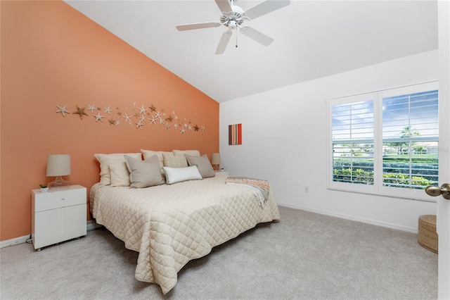 bedroom featuring ceiling fan, light carpet, and vaulted ceiling