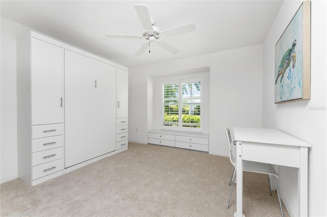 unfurnished office with light colored carpet and ceiling fan