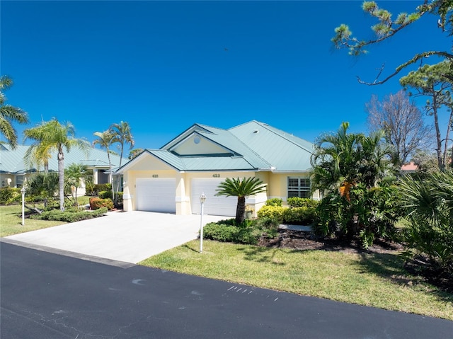 ranch-style home with a garage and a front yard