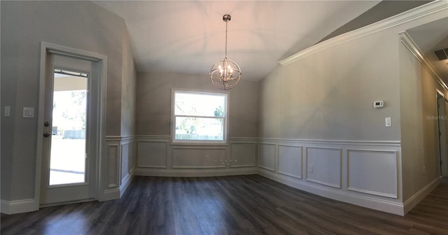 entrance foyer featuring a chandelier, dark hardwood / wood-style flooring, and lofted ceiling