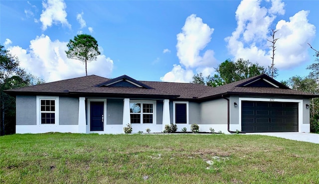 ranch-style home featuring a garage and a front lawn