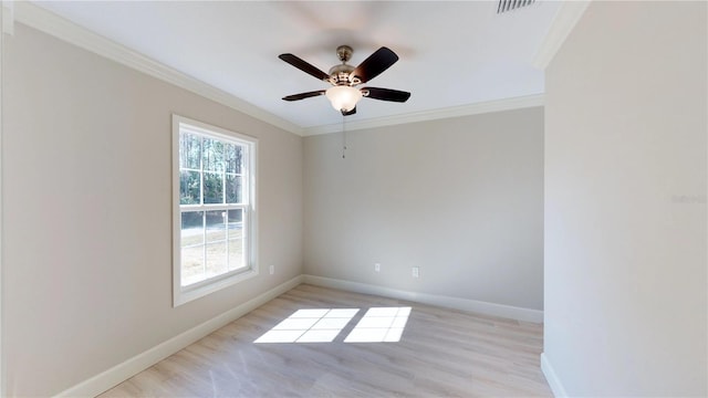 spare room with ceiling fan, crown molding, and light wood-type flooring