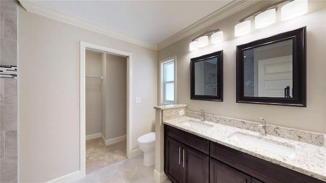 bathroom with dual sinks, vanity with extensive cabinet space, toilet, tile floors, and ornamental molding