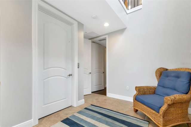 living area featuring light tile floors