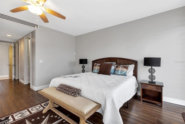 bedroom with dark wood-type flooring and ceiling fan