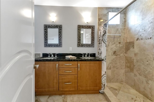 bathroom with double sink vanity and tile floors