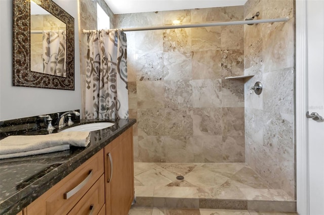 bathroom with a shower with curtain and large vanity