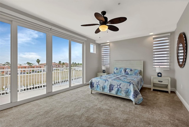 bedroom with carpet, ceiling fan, and access to outside