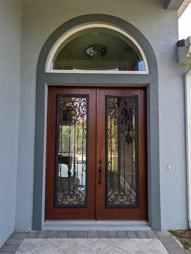 property entrance featuring french doors