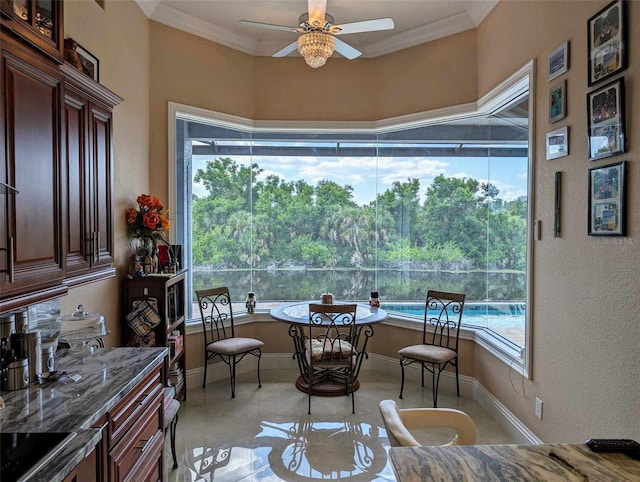 dining area with crown molding, ceiling fan, and a healthy amount of sunlight