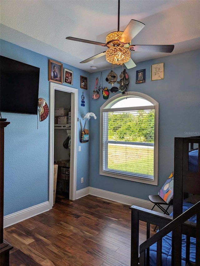 office area featuring ceiling fan and dark hardwood / wood-style floors