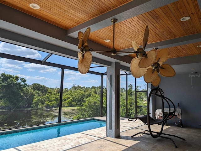 view of swimming pool featuring a patio and ceiling fan