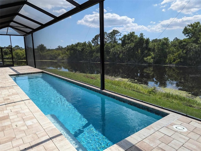 view of pool featuring a patio and glass enclosure