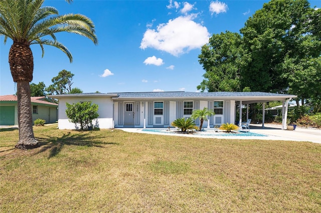 single story home featuring a carport and a front lawn