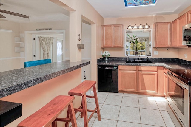 kitchen featuring appliances with stainless steel finishes, ceiling fan, light brown cabinetry, sink, and light tile floors