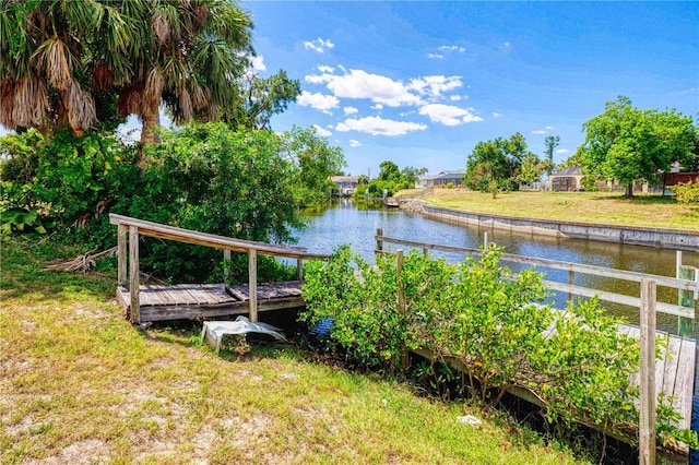 exterior space with a yard and a water view