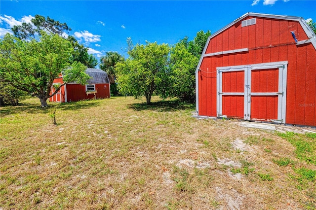 view of shed / structure featuring a yard