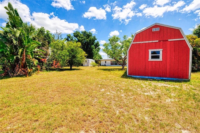 view of shed / structure with a lawn