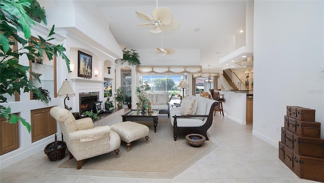 tiled living room with a towering ceiling and ceiling fan