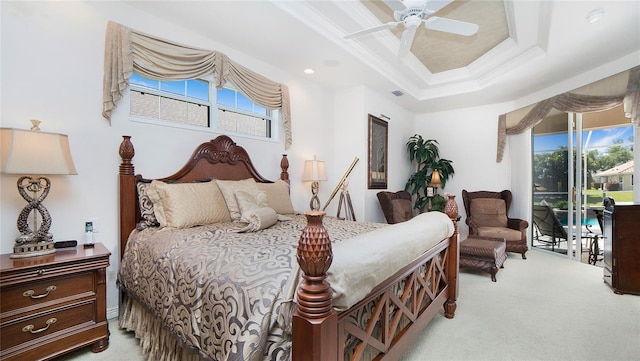 bedroom with carpet, crown molding, access to exterior, a tray ceiling, and ceiling fan