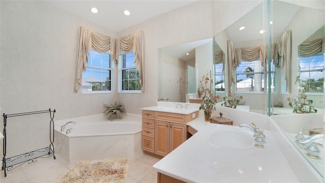 bathroom featuring double sink, vanity with extensive cabinet space, a bath, and tile flooring