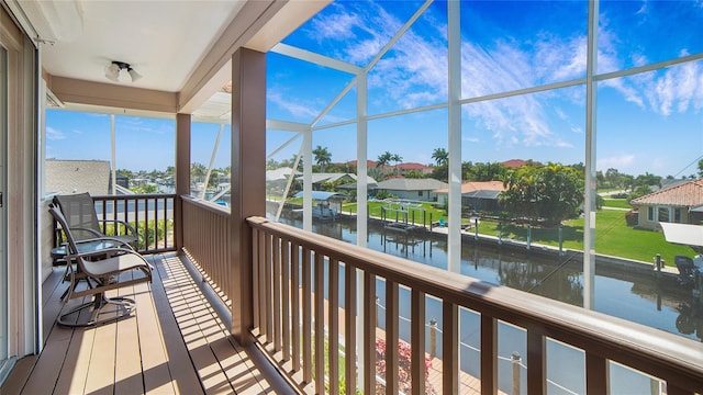 balcony featuring a water view