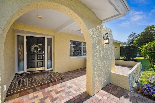 property entrance with a patio