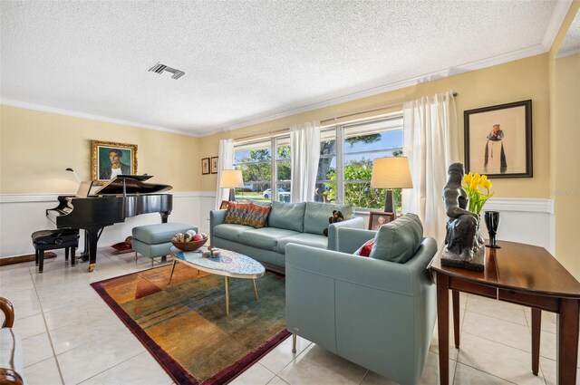 living room with a textured ceiling, light tile flooring, and ornamental molding