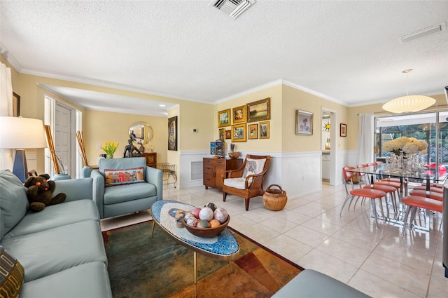 tiled living room with ornamental molding and a textured ceiling