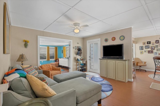 living room with light hardwood / wood-style floors and ceiling fan