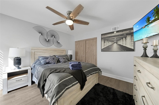 bedroom with ceiling fan and hardwood / wood-style flooring