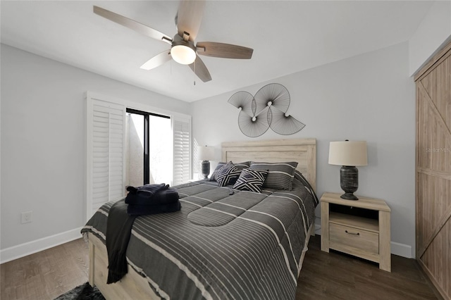 bedroom featuring dark wood-type flooring and ceiling fan