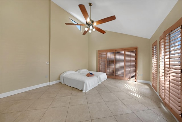 unfurnished bedroom featuring high vaulted ceiling, ceiling fan, and light tile floors