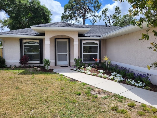 view of front of property with a front lawn