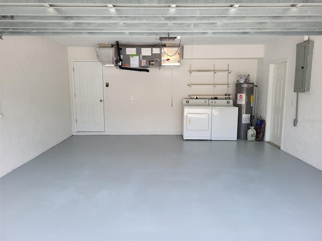 garage with washing machine and dryer and electric water heater