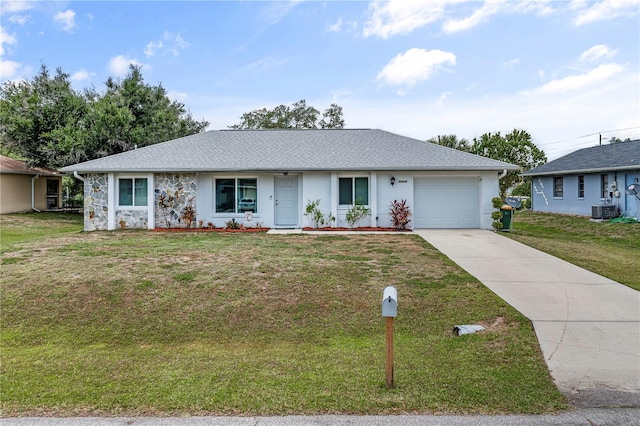 ranch-style house with a front lawn, a garage, and central air condition unit