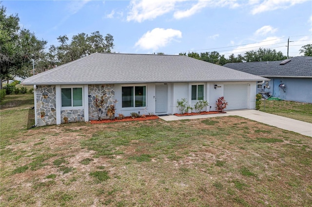 ranch-style house with a garage and a front lawn