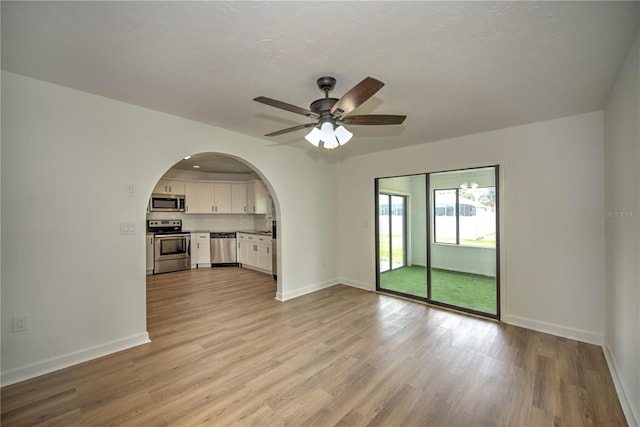 interior space featuring hardwood / wood-style flooring and ceiling fan