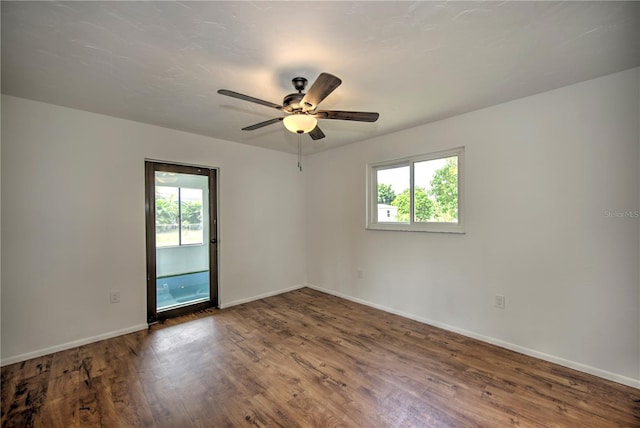 empty room featuring wood-type flooring and ceiling fan