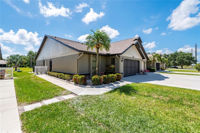 view of home's exterior featuring a lawn and a garage