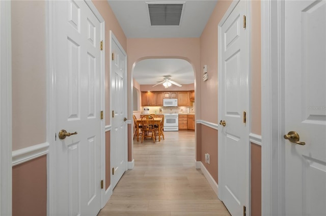 corridor featuring light wood-type flooring