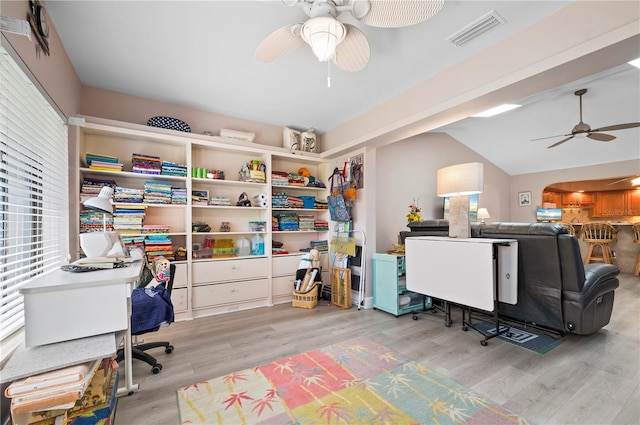 office with ceiling fan, light hardwood / wood-style floors, and vaulted ceiling