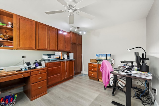 office with ceiling fan and light hardwood / wood-style flooring